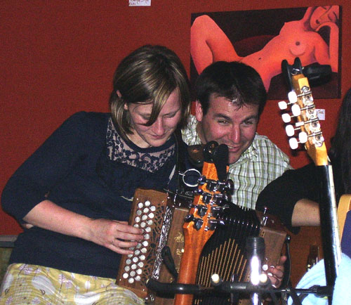 Isobel and Tim trying to play the same accordion